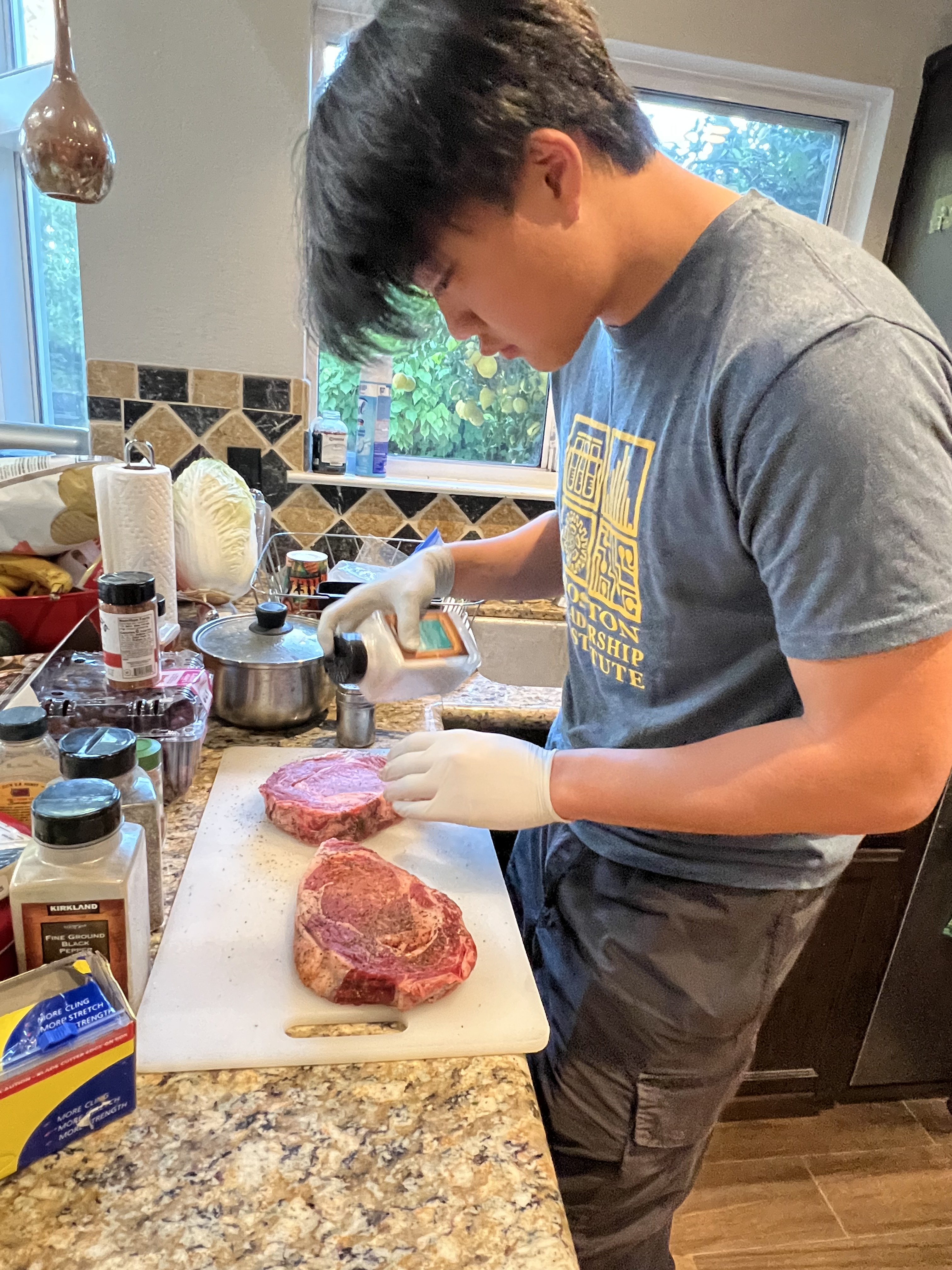 Peppering the steaks