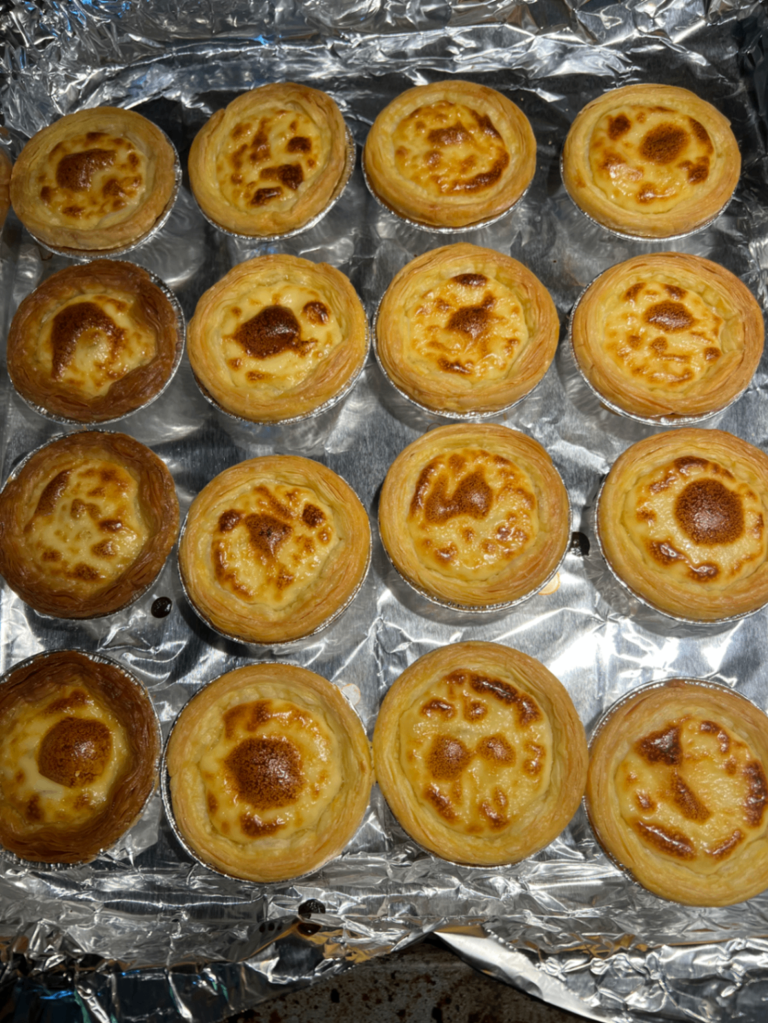 A tray of baked egg tarts